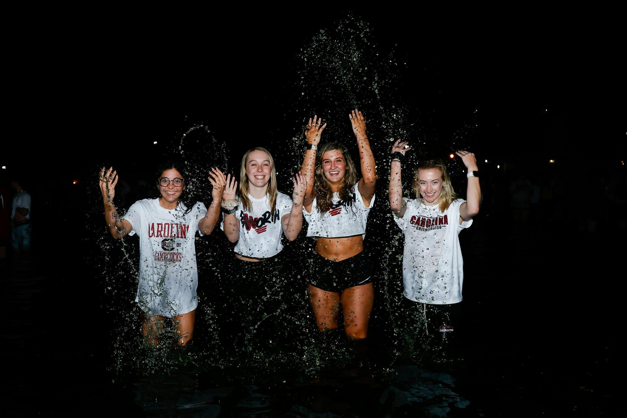 A group of South Carolina students splash in the Thomas Cooper Library fountain after hundreds of students jumped in the water to celebrate the women's basketball team’s win over the University of Connecticut in the national championship. 