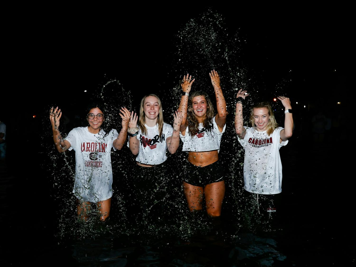 A group of South Carolina students splash in the Thomas Cooper Library fountain after hundreds of students jumped in the water to celebrate the women's basketball team’s win over the University of Connecticut in the national championship. 