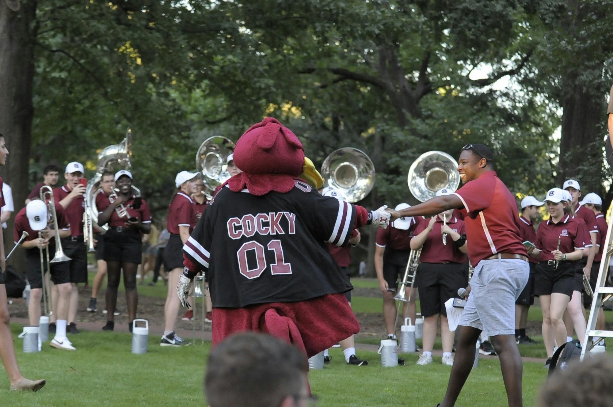 Cocky interacts with students on the horseshoe during First Night Carolina at the beginning of the fall semester.