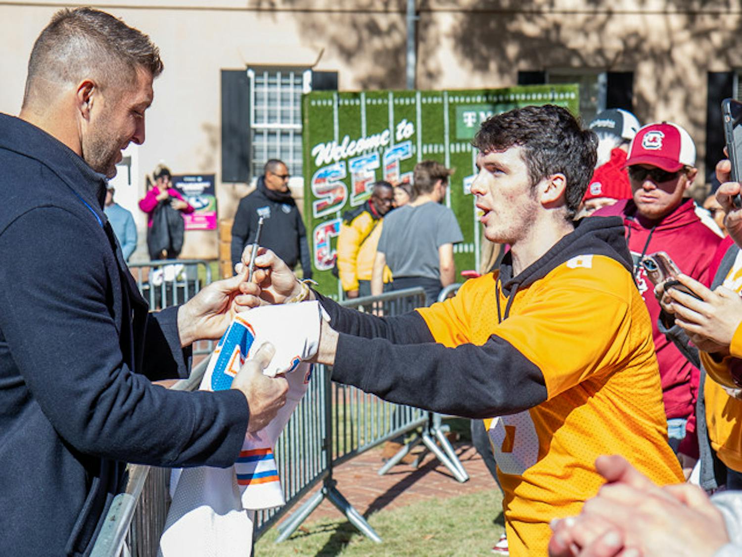 Tim Tebow signs a Tenessee fan's Florida jersey at the end of the SEC Nation pregame show on Nov. 19, 2022. Tim Tebow was a Hesiman trophy winner at Florida and played for several teams in the NFL.