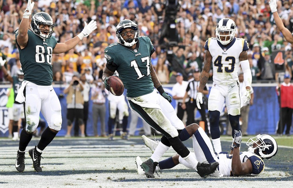 Philadelphia Eagles receiver Alshon Jeffery (17) celebrates his touchdown pass along with Trey Burton (88) in front of Los Angeles Rams safety Lamarcus Joyner as John Johnson (43) looks on in the third quarter on Sunday, Dec. 10, 2017 at the Coliseum in Los Angeles, Calif. (Wally Skalij/Los Angeles Times/TNS)
