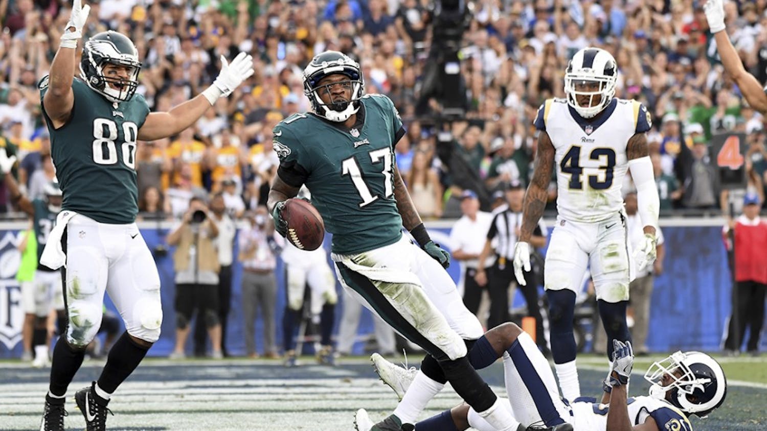 Philadelphia Eagles receiver Alshon Jeffery (17) celebrates his touchdown pass along with Trey Burton (88) in front of Los Angeles Rams safety Lamarcus Joyner as John Johnson (43) looks on in the third quarter on Sunday, Dec. 10, 2017 at the Coliseum in Los Angeles, Calif. (Wally Skalij/Los Angeles Times/TNS)