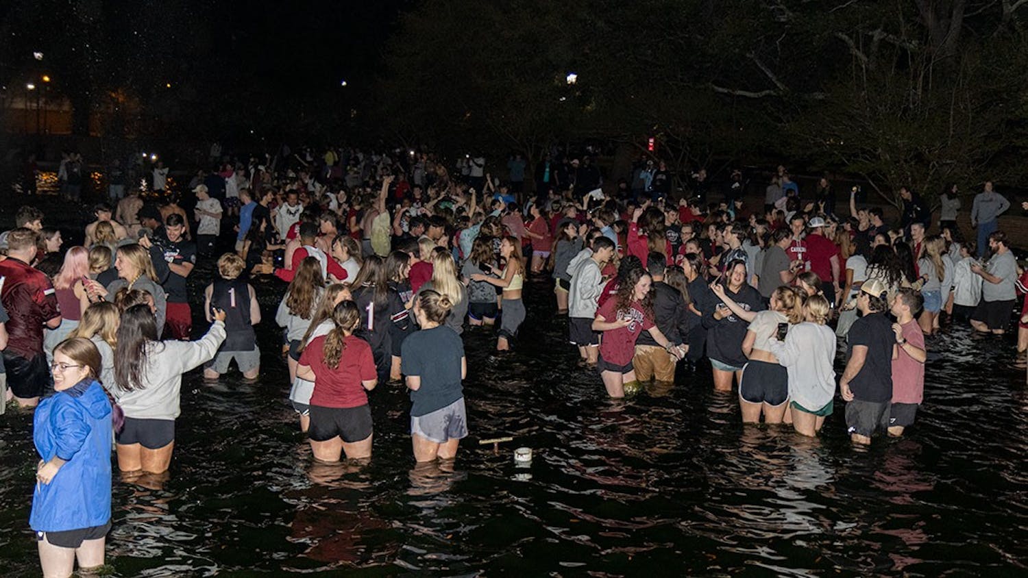 A sea of Gamecock fans in the reflection pond outside Thomas Cooper Library. This follows the women's basketball team winning the national championship.
