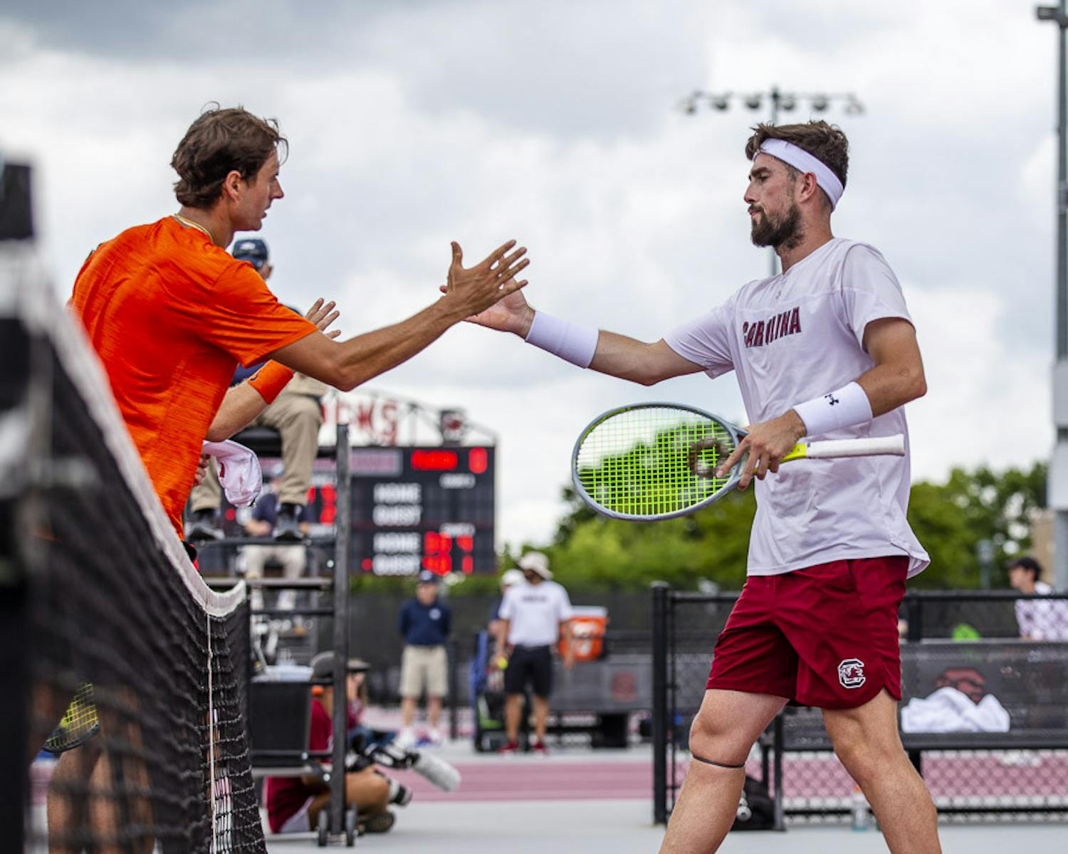 Junior Connor Thomson (right) goes in to shake University of Florida graduate student Axel Nefve's hand (left) after Thomson and his teammate, junior Toby Samuel, lost their doubles match on April 16, 2023. &nbsp;The Gamecocks beat the Gators 5-2 overall.&nbsp;