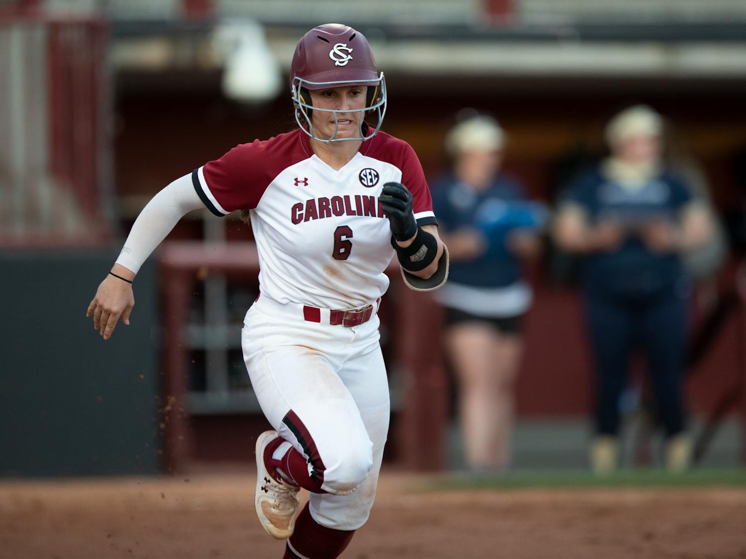 FILE— Senior catcher Jordan Fabian runs to first to beat out the ground ball where she was called safe during the Charleston Southern game in Columbia, SC. The Gamecocks beat the Buccaneers in both games on March 2, 2022. 