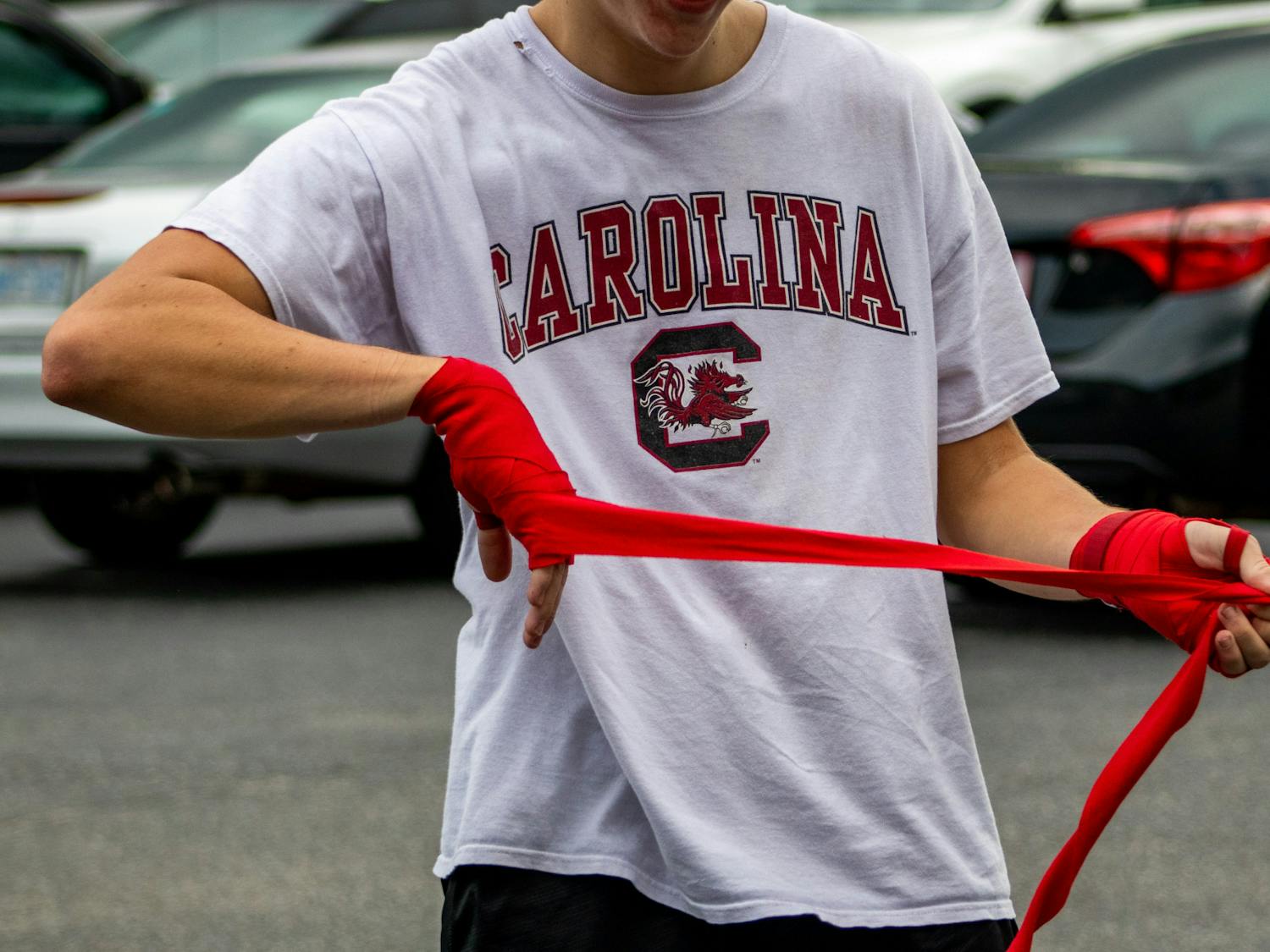 A member of the Carolina Boxing Club wraps his hands before practice. The Carolina Boxing Club gathered Sept.12, 2022, at Battle Boxing Gym to prepare for their upcoming season