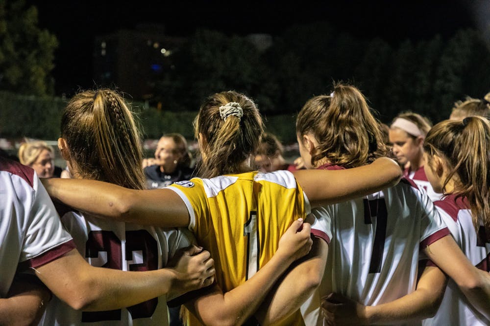 <p>The women's soccer team in a huddle during a time-out during a game against the Georgia Bulldogs.&nbsp;</p>