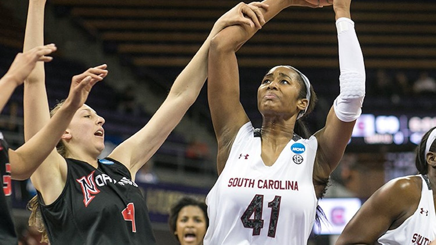 South Carolina's Alaina Coates (41) gets the rebound and attempts the put back in the second half, but gets fouled by CSU Northridge's Camille Mahlknecht during the first round of the women's NCAA Tournament in Seattle on Sunday, March 23, 2014. (Dean Rutz/Seattle Times/MCT)