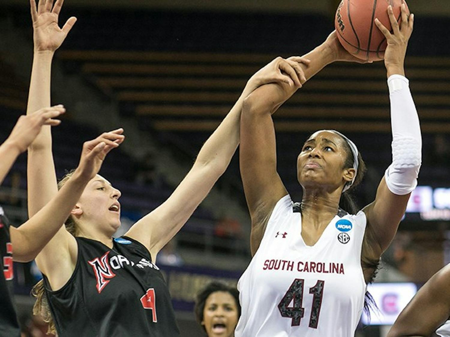 South Carolina&apos;s Alaina Coates (41) gets the rebound and attempts the put back in the second half, but gets fouled by CSU Northridge&apos;s Camille Mahlknecht during the first round of the women&apos;s NCAA Tournament in Seattle on Sunday, March 23, 2014. (Dean Rutz/Seattle Times/MCT)