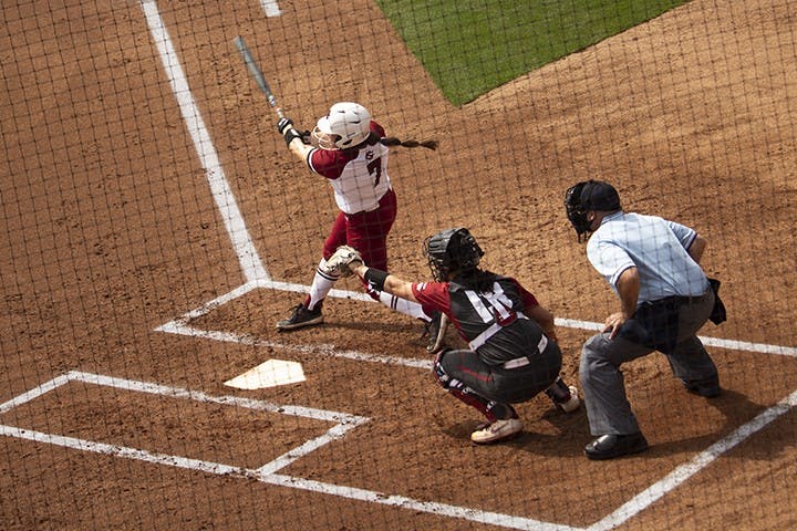 &nbsp;Graduate infielder Mackenzie Boesel hits the ball during Sunday’s game against Arkansas. The Razorbacks won 3-2.&nbsp;
