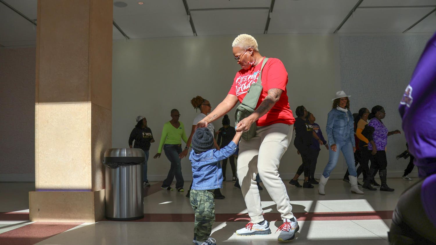 A woman and a young child hold hands and dance at the Martin Luther King Jr. Day Line Dancing Event at the Boyd Plaza on Jan. 20, 2025. The Columbia Museum of Art hosted a special Martin Luther King Jr. Day program in honor of Martin Luther King Jr. Day featuring storytelling and line dancing.