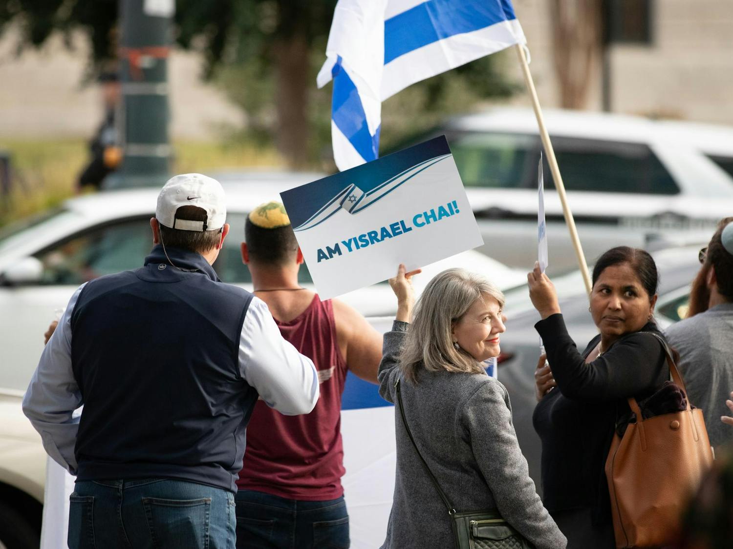 An Israeli counter-protestor stands across the street from the South Carolina Statehouse holding a sign reading "Am Yisrael Chai!" A group of Israeli supporters gathered across from the Free Palestine Emergency Demonstration on Oct. 17, 2023 to show their opposition to the Palestinian cause.