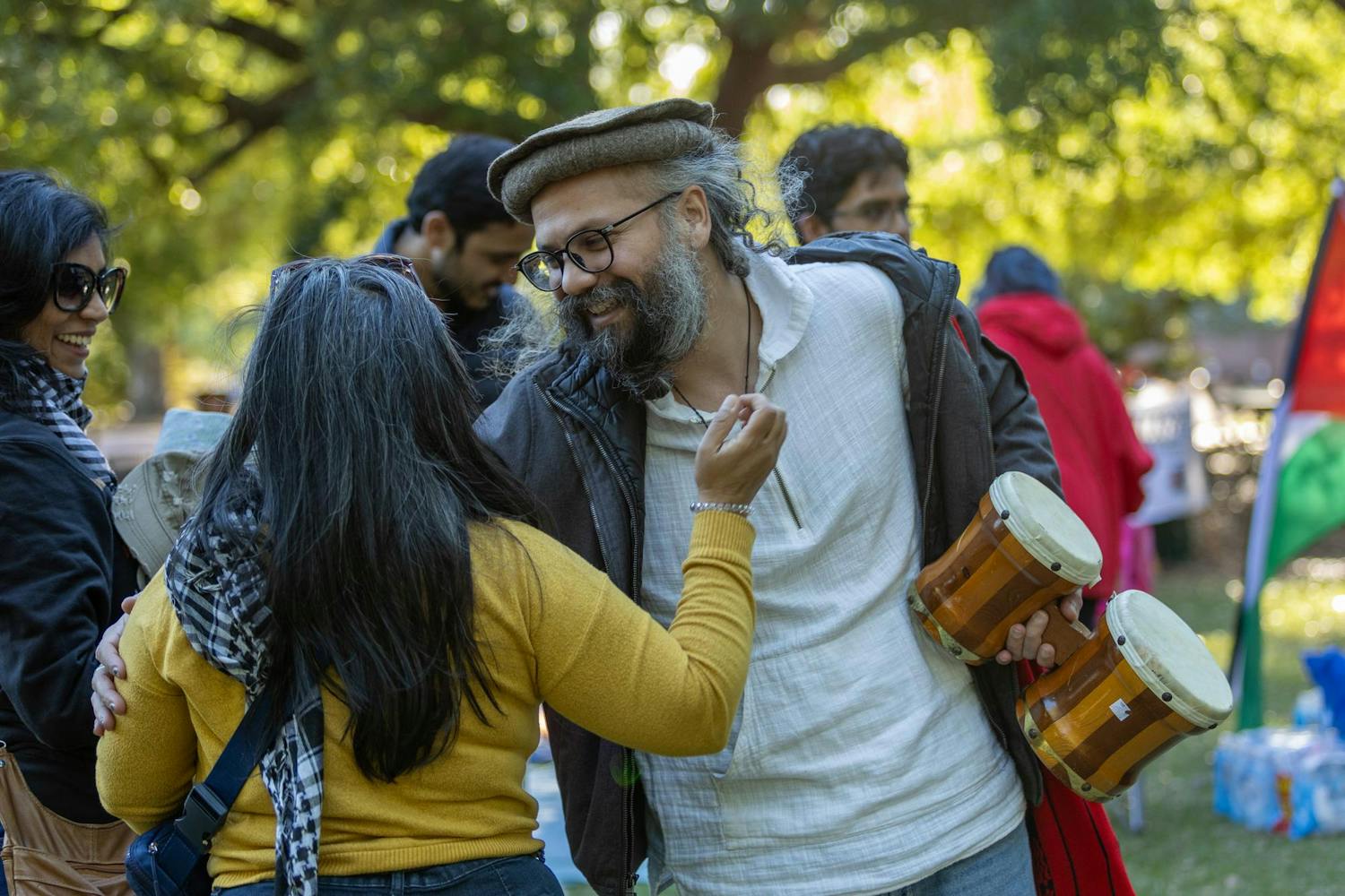 Attendees of the "Anti-Zionist Passover" greet one another with a hug. A group fluctuating between 30 and 40 people attended the event on April 22, 2024.