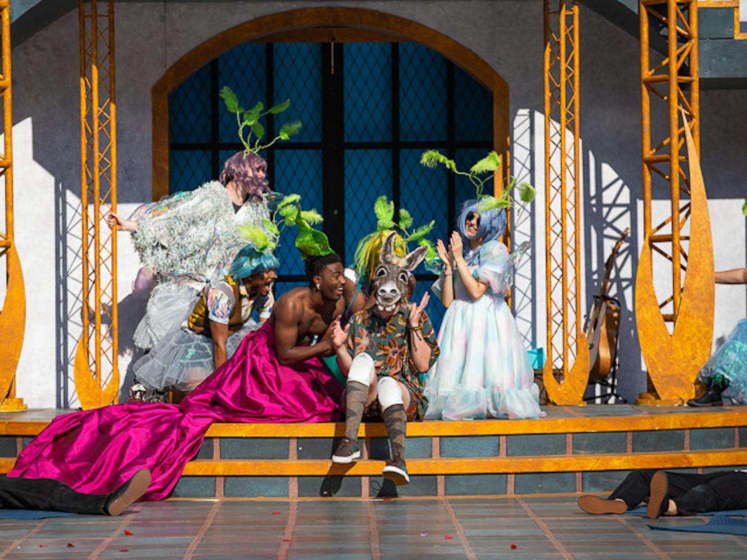 Characters Oberon (front left) and Bottom (front right), portrayed by second-year theater student Rowland Marshall and third-year theatre and English student Michael Williamson interact on stage as fairies dance around them during "A Midsummer Night's Dream" on Oct. 9, 2022. &nbsp;USC Department of Theatre and Dance held the play from October 2 to 9, 2022.&nbsp;