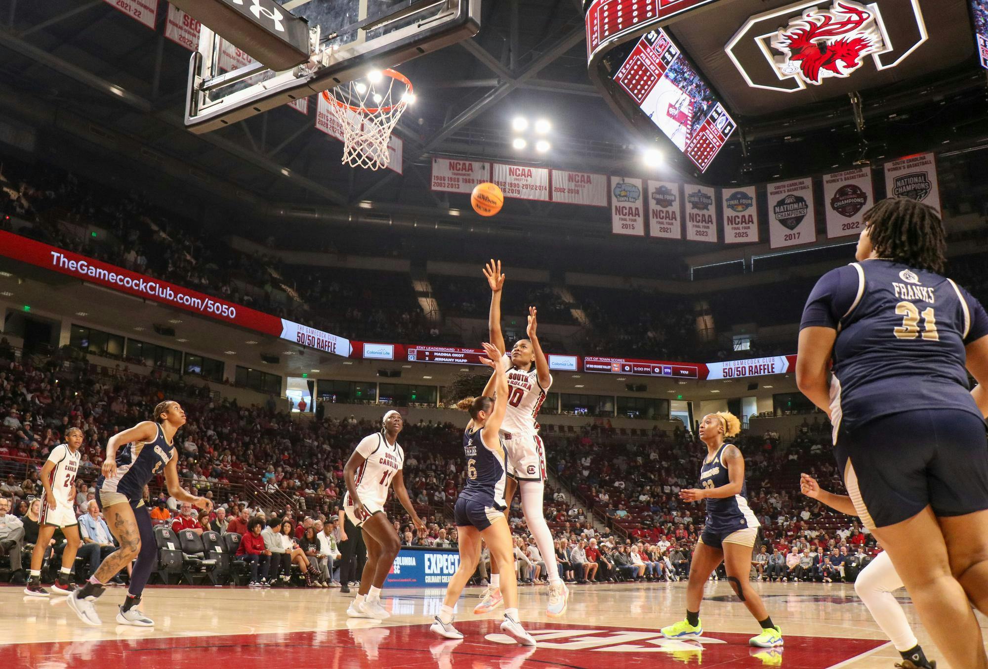 Senior guard Ta'Niya Latson jumps for a shot while being guarded by Queens University of Charlotte players on Nov. 23, 2025 at Colonial Life Arena. The Gamecocks had a total of 51 rebounds with 10 offensive rebounds and 41 defensive rebounds.&nbsp;