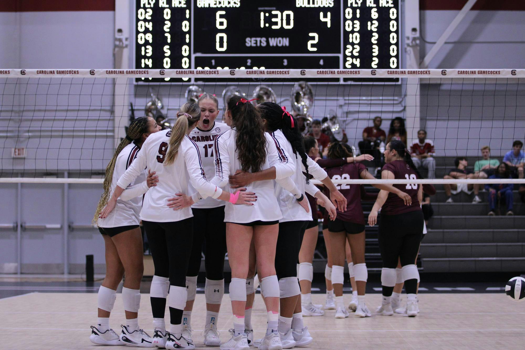 The South Carolina volleyball team celebrates in a group huddle after scoring a point against Mississippi State in their match on Oct. 17, 2025. The Gamecocks lost to MSU in the third set, with a final score of 3-0.