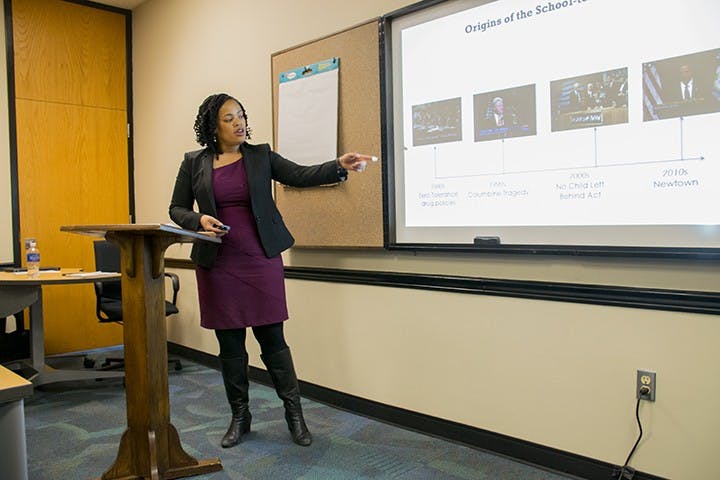 Thena Robinson-Mock, the project director of Ending the Schoolhouse to Jailhouse Track program, explains the origin and expansion of the school-to-prison pipeline at the Get in&nbsp;#Formation lecture on Monday.&nbsp;