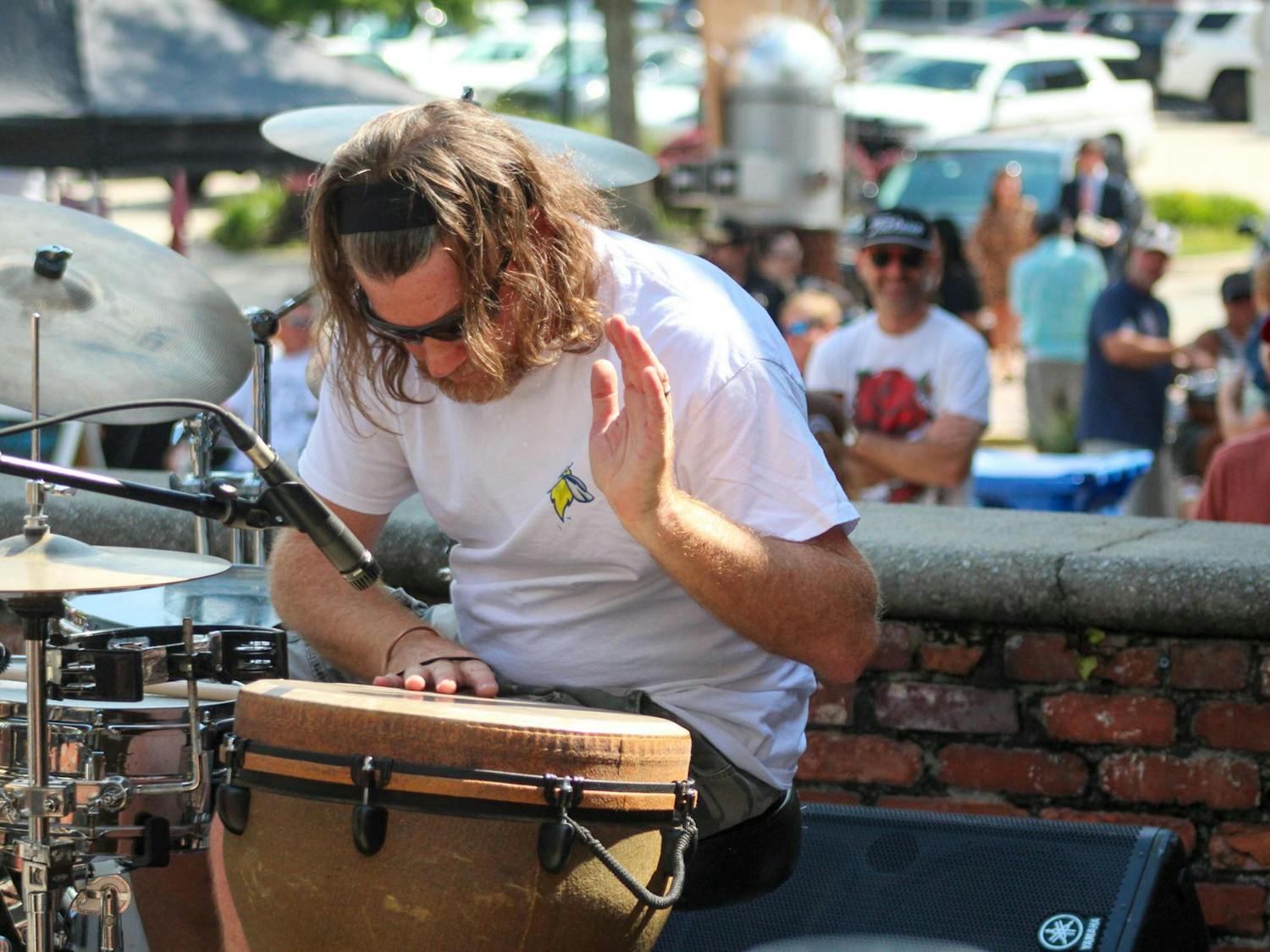 The drummer from Ten Mile Ride plays the bongos at JerryFest on Oct. 6, 2024. Ten Mile Ride was one of the bands featured at the JerryFest festival in Five Points.