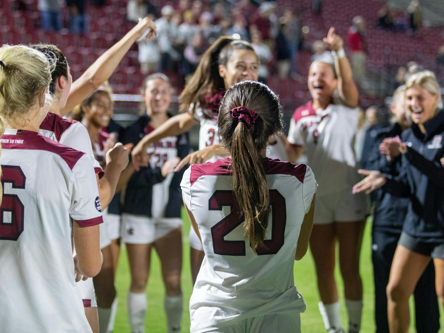 FILE— Senior defender Camryn Dixon and junior forward Corinna Zullo celebrate with their team after the win against Missouri on Oct. 27, 2022. After Thursday’s result on Nov. 3, 2022 there will be a title matchup between No. 1 seed Alabama and No. 2 seed South Carolina, regular season winners of the SEC West and East respectively.&nbsp;