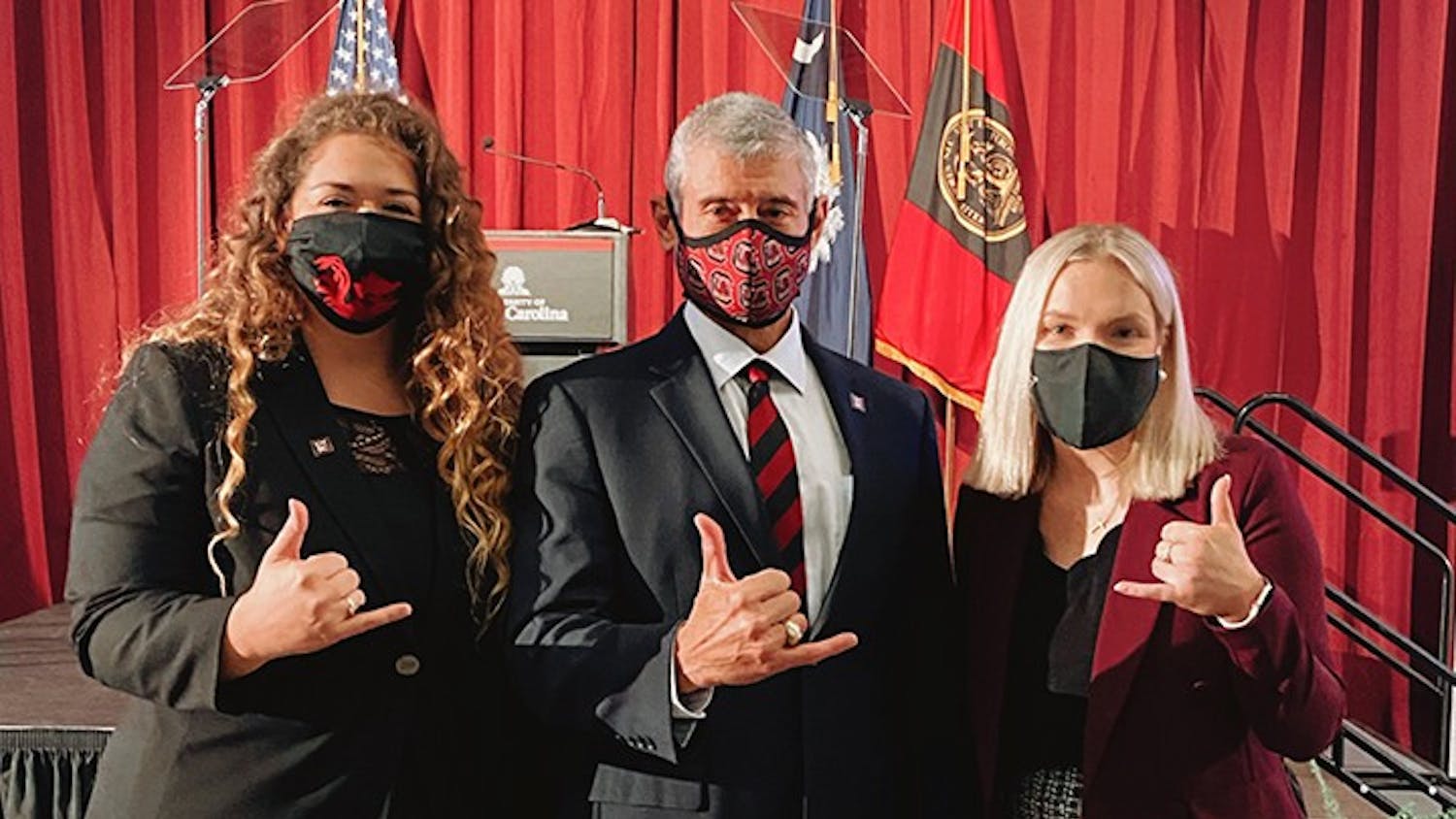 Issy Rushton, USC’s student body president for the 2020-2021 school year, and Maggie Carson, president of the Graduate Student Association, stand with university President Bob Caslen.