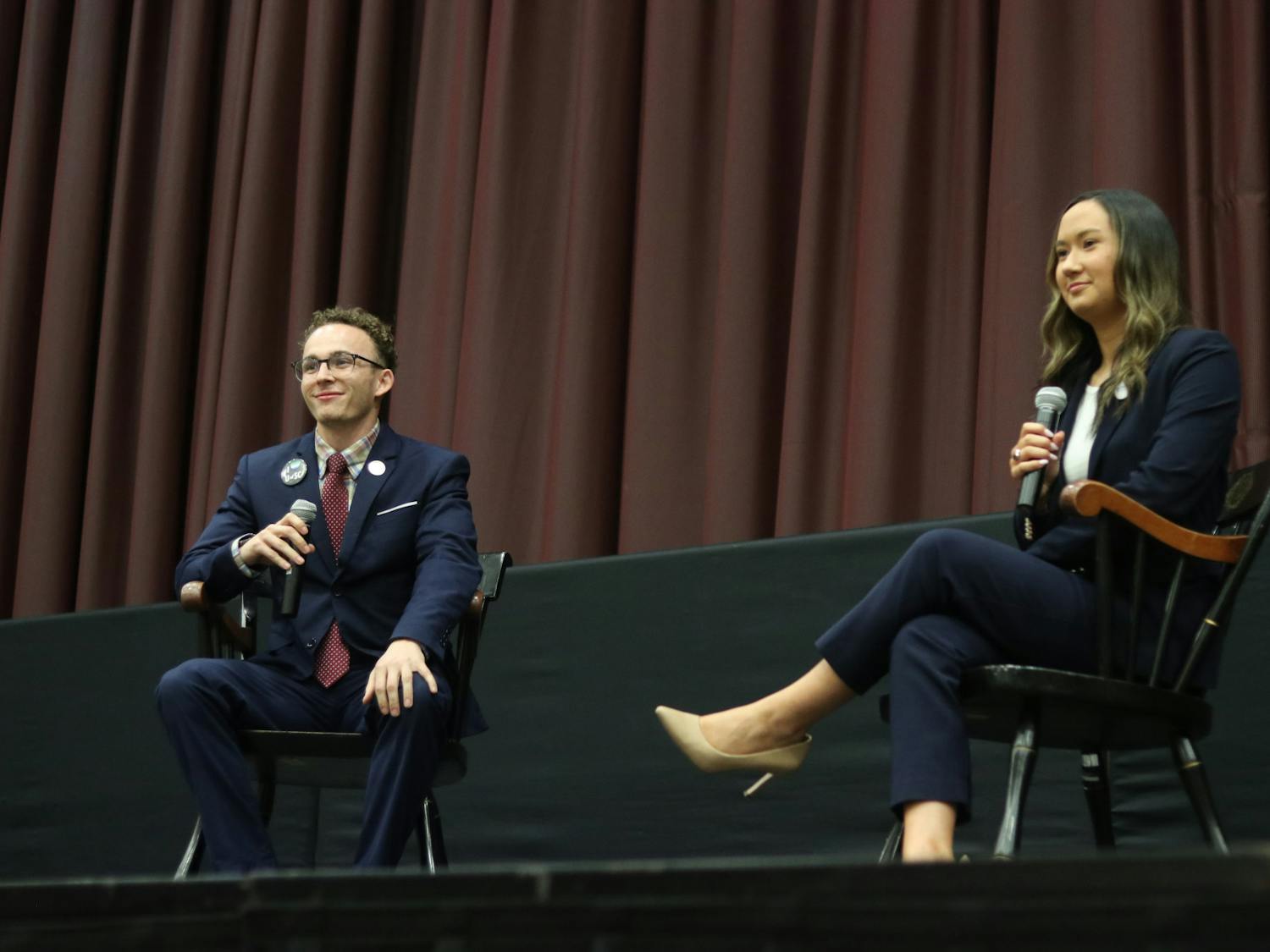 Student body presidential candidates third-year political science student Reilly Arford (left) and third-year public relations student Emily "Emmie" Thompson (right) on stage debating on Feb. 15, 2023. They are the only two presidential candidates this election season. 