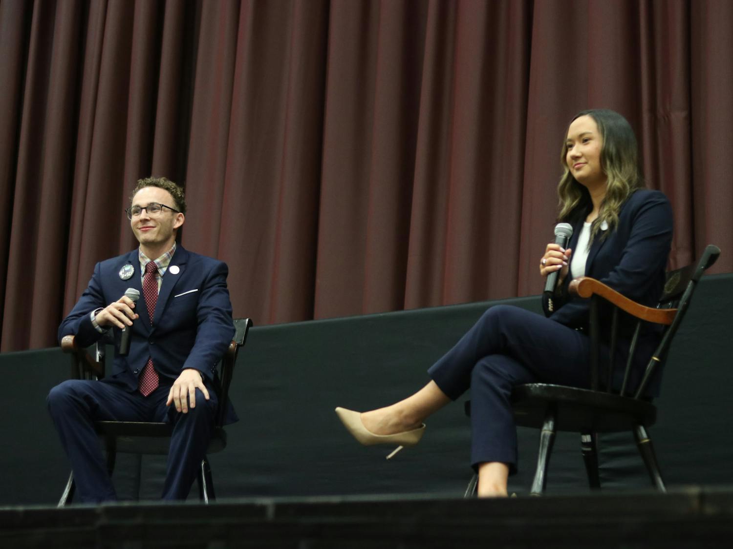 Student body presidential candidates third-year political science student Reilly Arford (left) and third-year public relations student Emily "Emmie" Thompson (right) on stage debating on Feb. 15, 2023. They are the only two presidential candidates this election season.&nbsp;