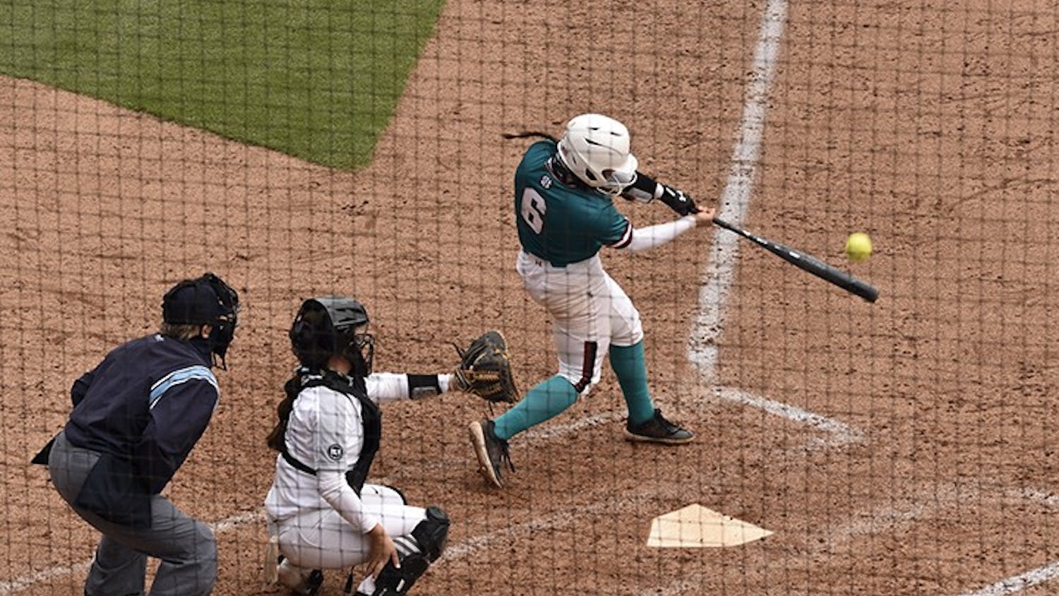 Junior catcher Jordan Fabian connects on a pitch in Sunday's game against the University of Central Florida. The Gamecocks wore teal for “All for Alex,” which is an organization that aids in the fight against ovarian cancer.&nbsp;