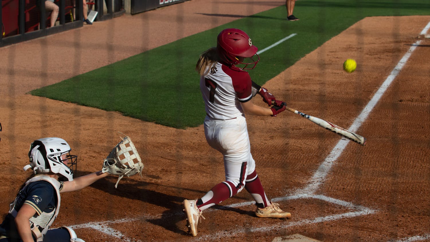 Sophomore catcher and infielder Guilia Desiderio hits a flyball against Charleston Southern on April 19, 2023. In the second game of a doubleheader, the Gamecocks beat the Buccaneers 11-2 in five innings. &nbsp;