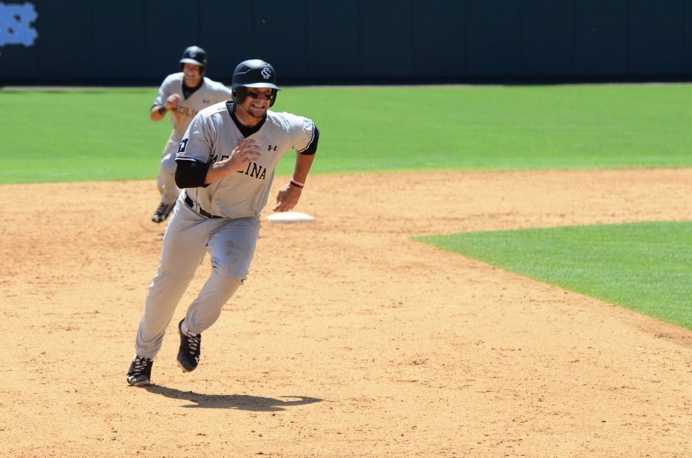 Gamecocks outfielder Graham Saiko rounds third base to score for the Gamecocks.