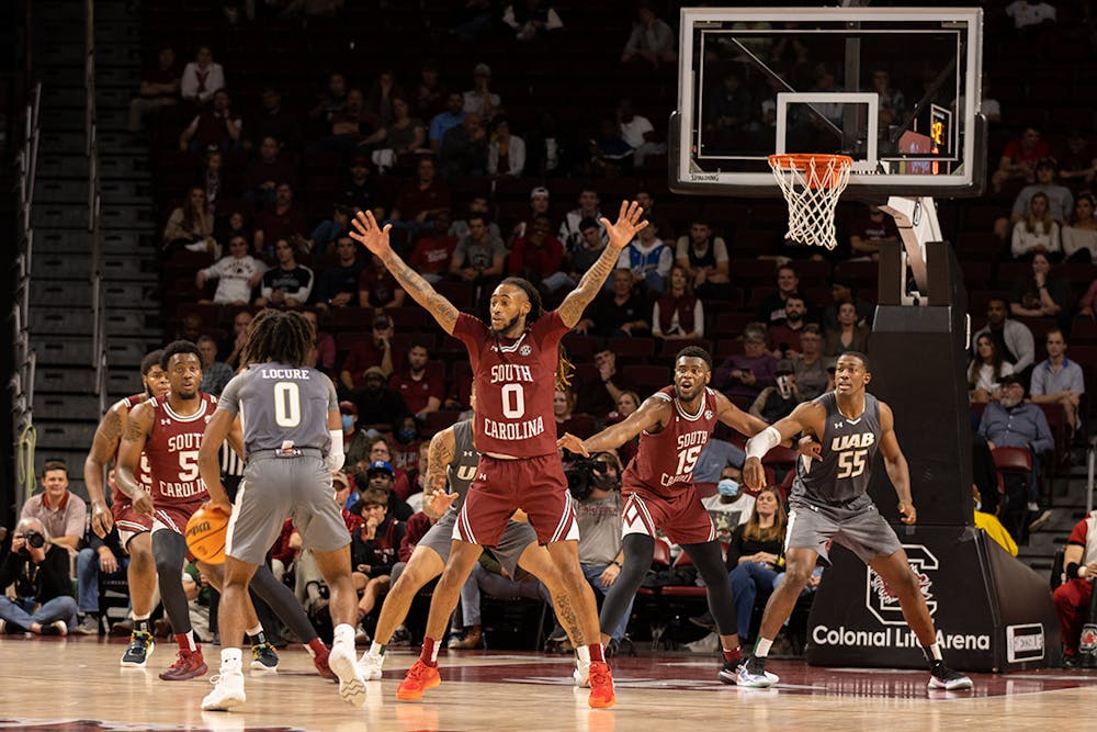 <p>Graduate student guard James Reese blocking a clear shot for a UAB player. Reese contributed 14 points to the Gamecocks' 66-63 win over UAB on Thursday, Nov. 18, 2021.</p>