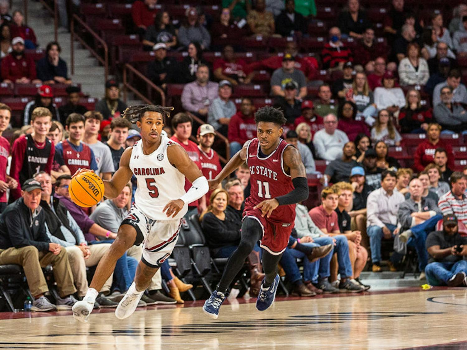 Junior guard Meechie Johnson explodes down the court and past S.C. State players during a breakaway. The Gamecocks defeated the Bulldogs 80-77 in their season opener on Nov. 8, 2022.