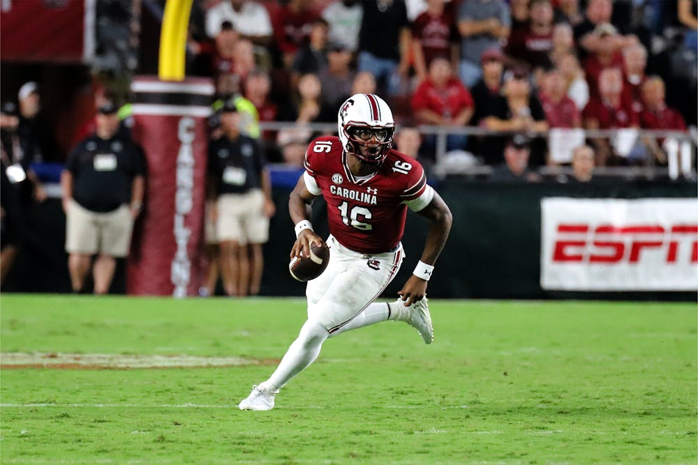 <p>Freshman quarterback LaNorris Sellers looks for an open player to throw the ball to late in South Carolina's 47-21 victory over Furman. A former top five recruit in the state, Sellers made his official debut and passed for 86 yards and two touchdowns against the Paladins.</p>
