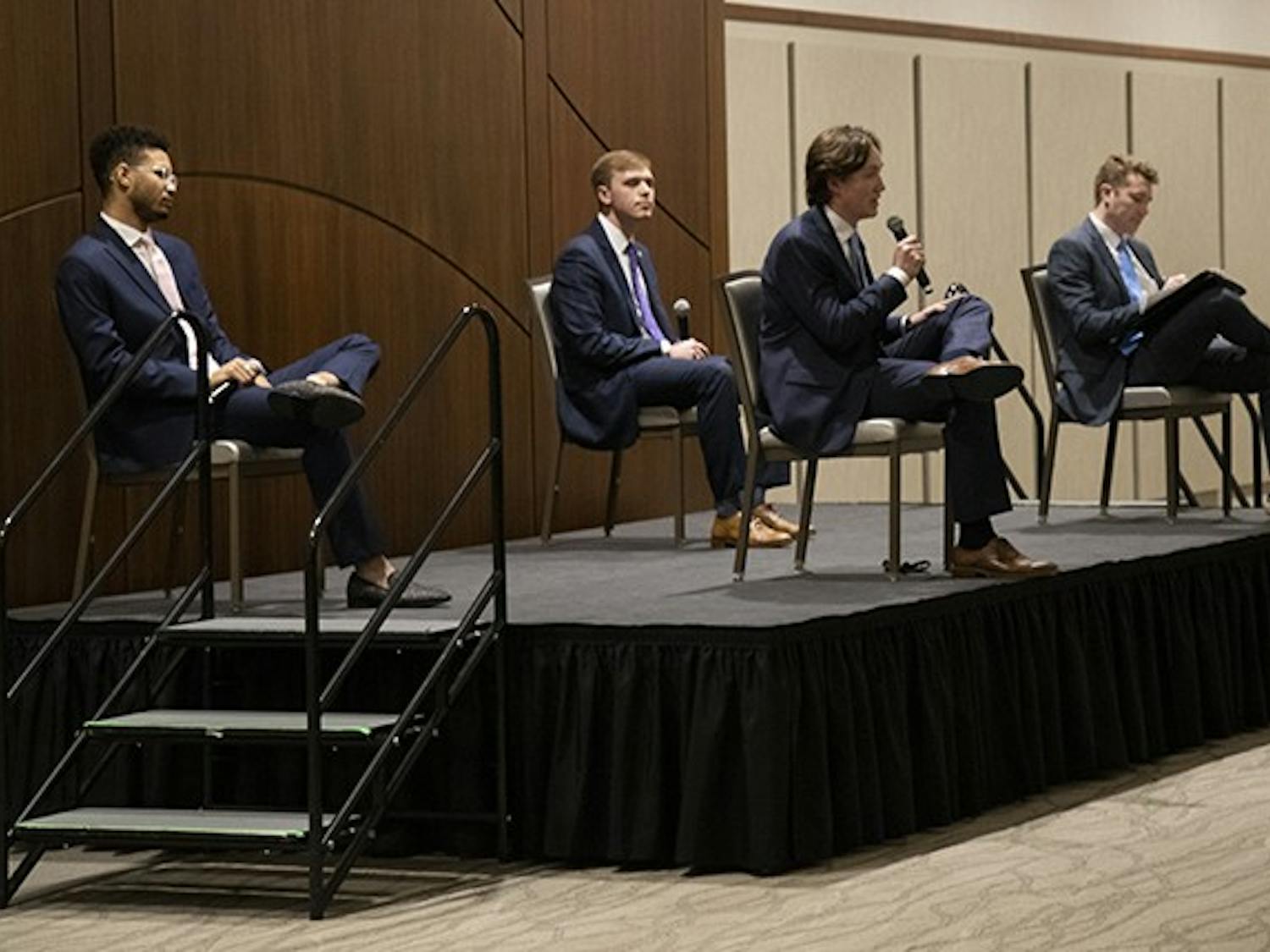Student body president candidates (from left to right) Aidan Baker, Alex Harrell and Cameron Butler listen to Caden Askew's answer to a question. The candidates were asked a series of general questions, individual questions and questions pulled from social media.