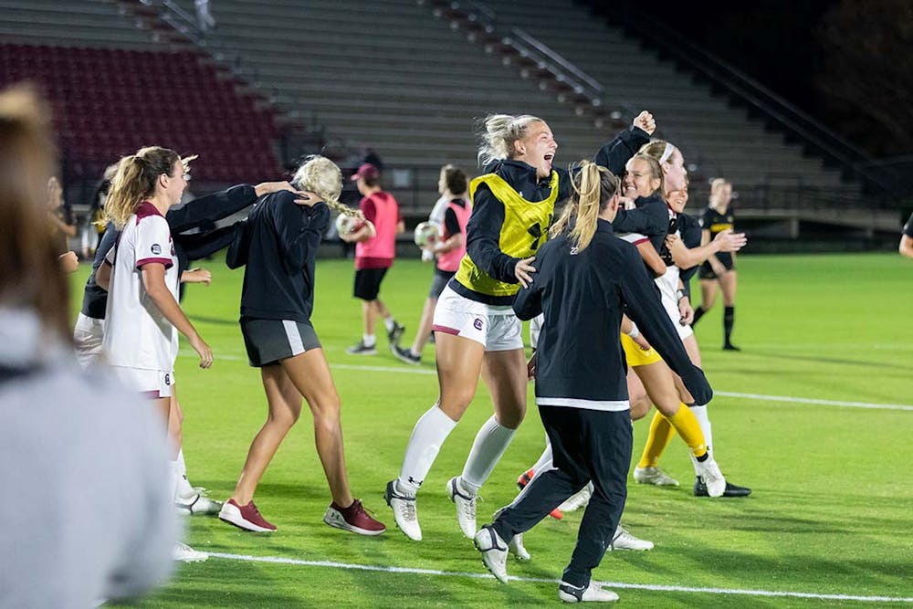 <p>The Gamecocks celebrate on the field after the matchup against Missouri on Oct. 27, 2022. The Gamecocks beat Missouri 2-0 and clinched the SEC East with the win.</p>