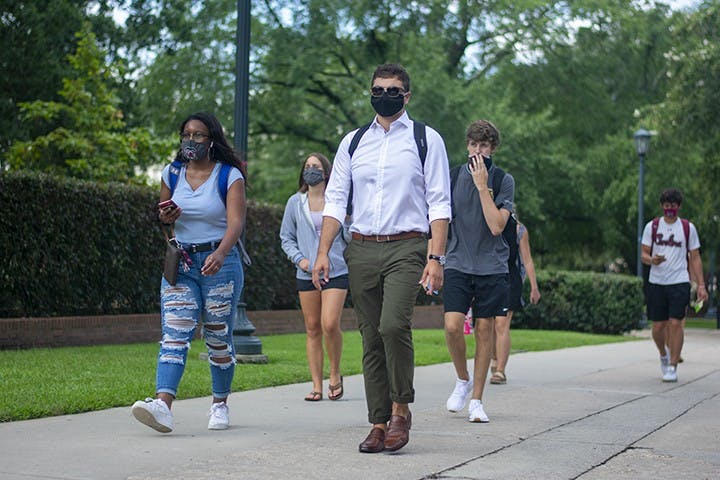USC students walk down Greene Street with masks on. Wearing masks on campus became part of many students' daily lives in the 2020-2021 school year.