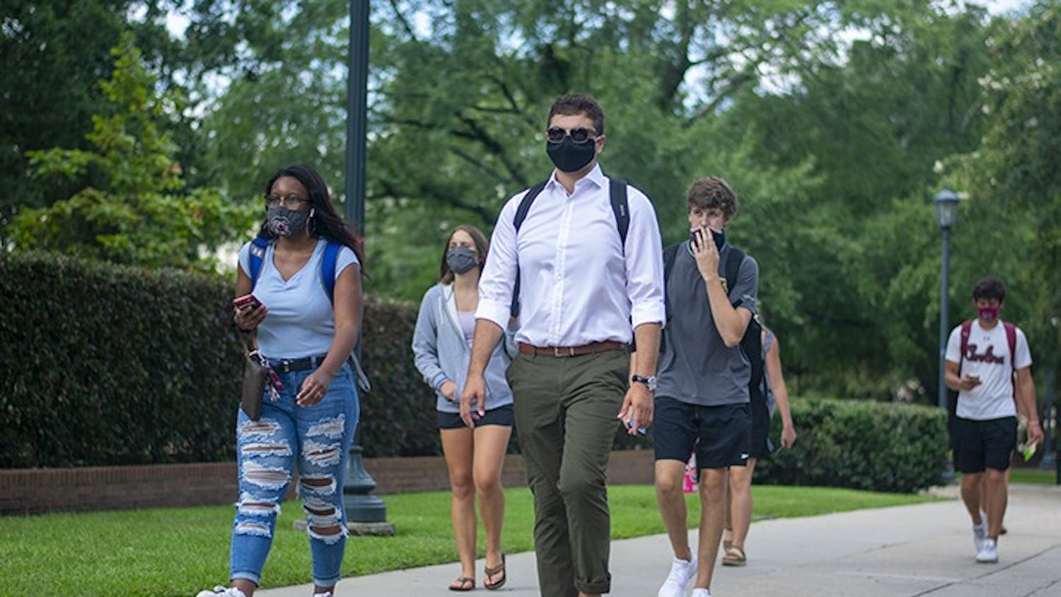 USC students walk down Greene Street with masks on. Wearing masks on campus became part of many students' daily lives in the 2020-2021 school year.