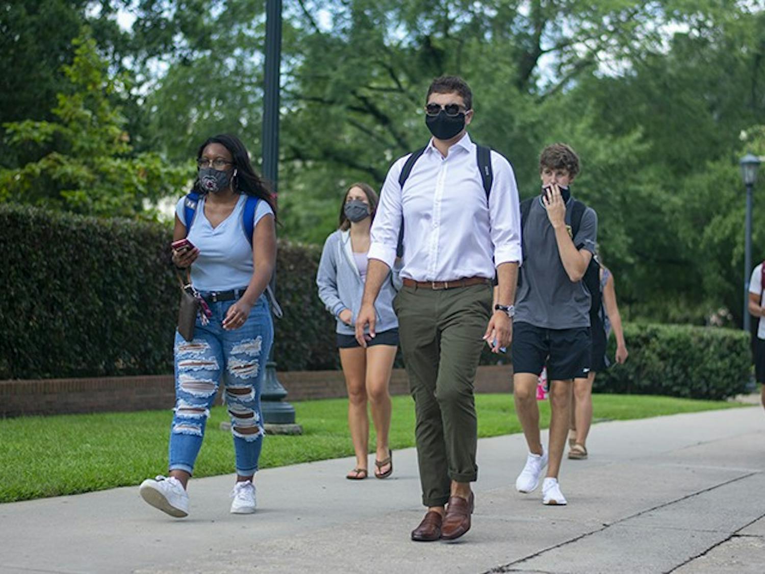 USC students walk down Greene Street with masks on. Wearing masks on campus became part of many students' daily lives in the 2020-2021 school year.