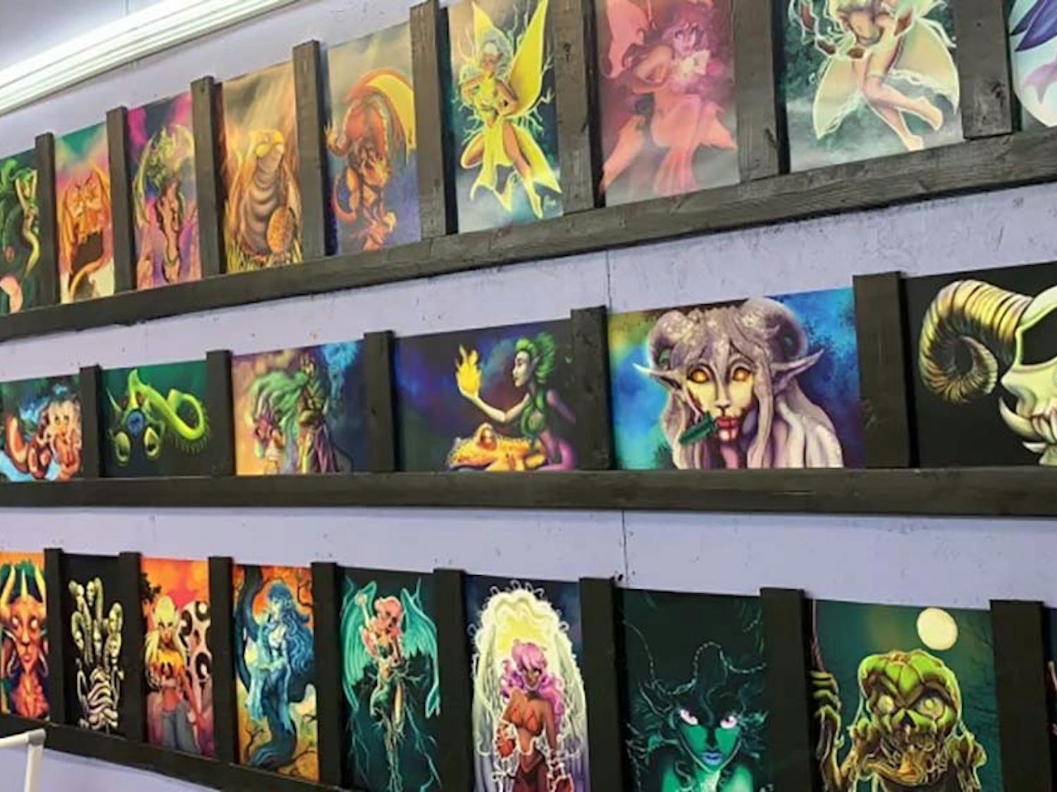 Melissa Pierce's artwork hanging in her shop for sale in The Barnyard Flea Market at 4414 Agusta Rd in Lexington, SC.