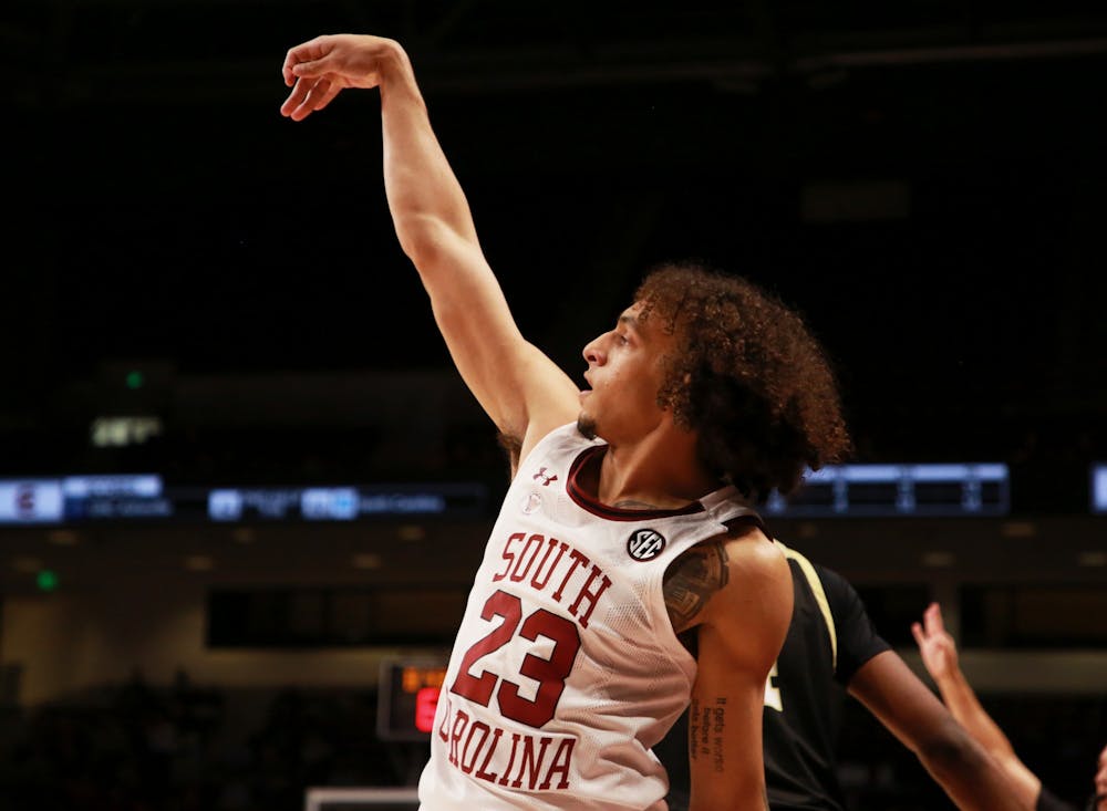 <p>Freshman guard Devin Carter shoots a 3-pointer in the second half. The Gamecocks won over Wofford 85-74 on Tuesday, Nov. 23, 2021.&nbsp;</p>