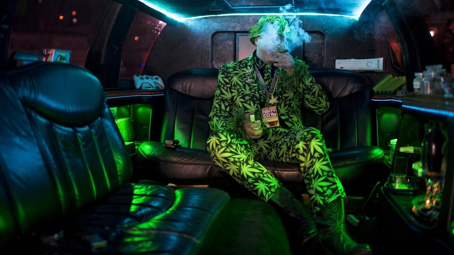 Mike Barnes takes a celebratory puff in his privately owned "420 Limo" at an election party in Oakland, Calif., after the passage of proposition 64, which legalized and taxed the recreational use of marijuana in California, in November 2016. (Andrew Seng/Sacramento Bee/Zuma Press/TNS)