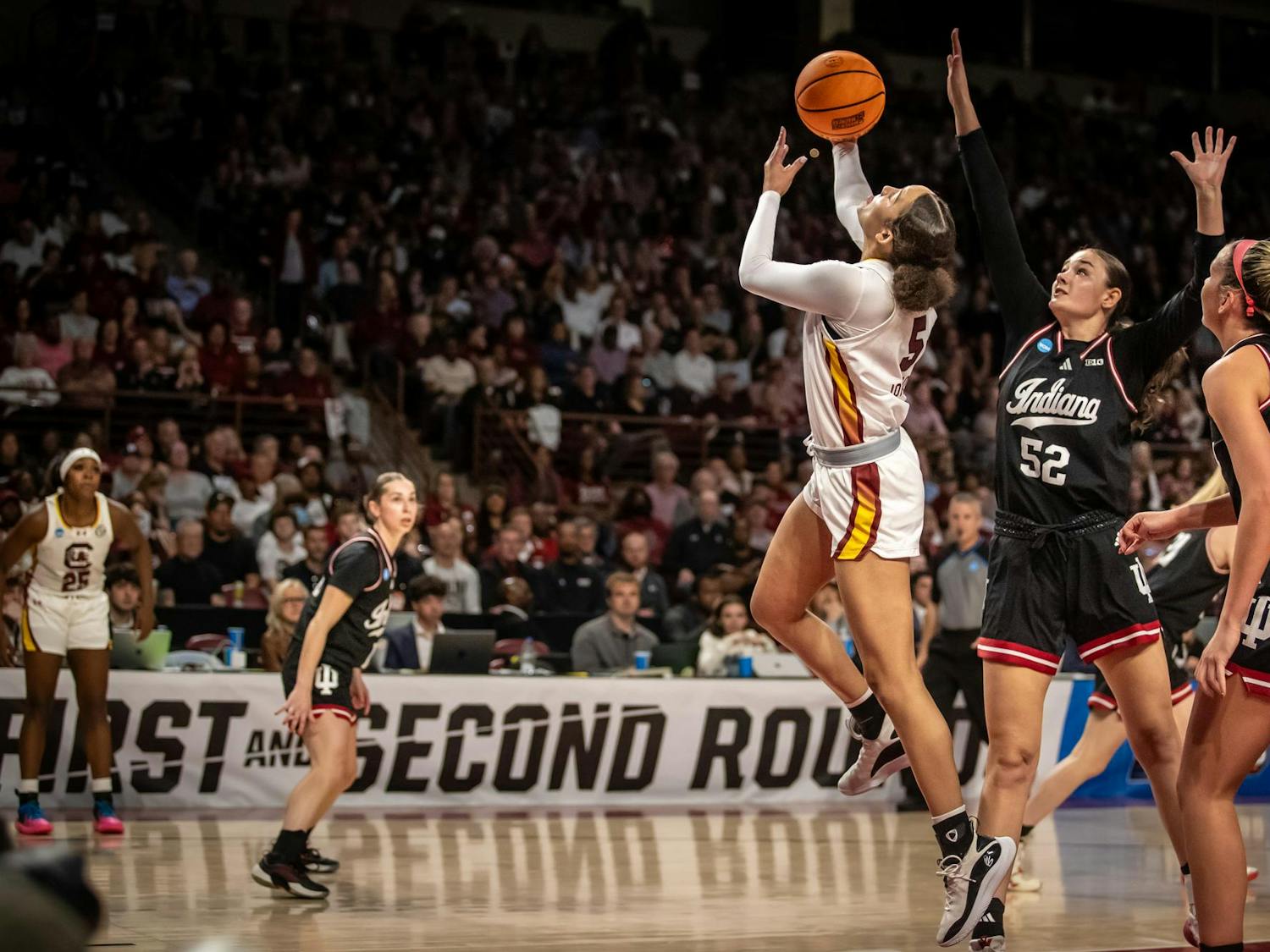Sophomore guard Tessa Johnson hits a layup against two Indiana defenders on March 23, 2025. Johnson scored 9 of the Gamecock’s 64 points.