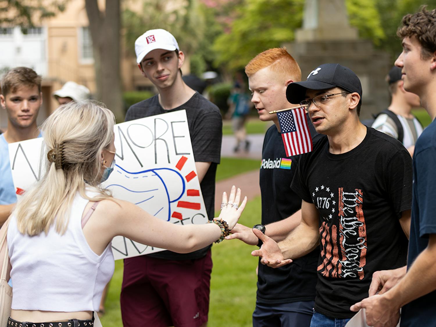 The USC Turning Point USA chapter members and members of the Carolina Socialists debate on the Horseshoe on their stances of the mask mandate. The mask mandate was put in place by interim president Harris Pastides on Aug. 18, 2021.