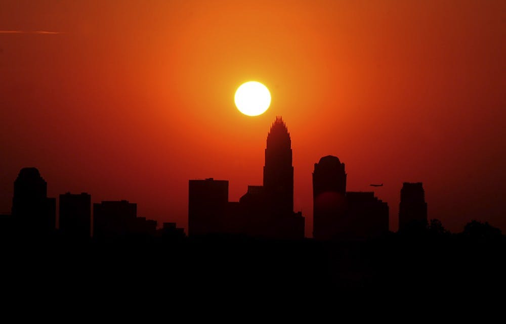 The skyline of Charlotte, North Carolina, is silhouetted against the sky as the sun sets on Friday, June 29, 2012. Charlotte equalled its all-time high temperature record Friday with a 104-degree day entering the record books. (Jeff Siner/Charlotte Observer/MCT)