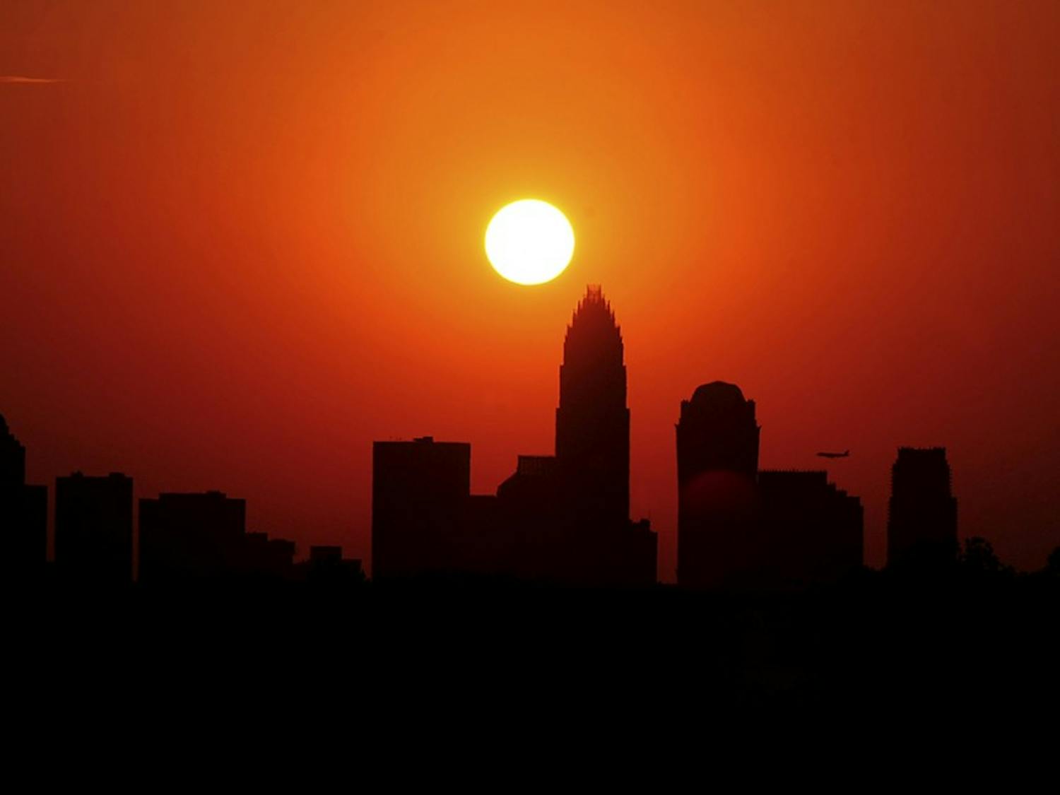 The skyline of Charlotte, North Carolina, is silhouetted against the sky as the sun sets on Friday, June 29, 2012. Charlotte equalled its all-time high temperature record Friday with a 104-degree day entering the record books. (Jeff Siner/Charlotte Observer/MCT)