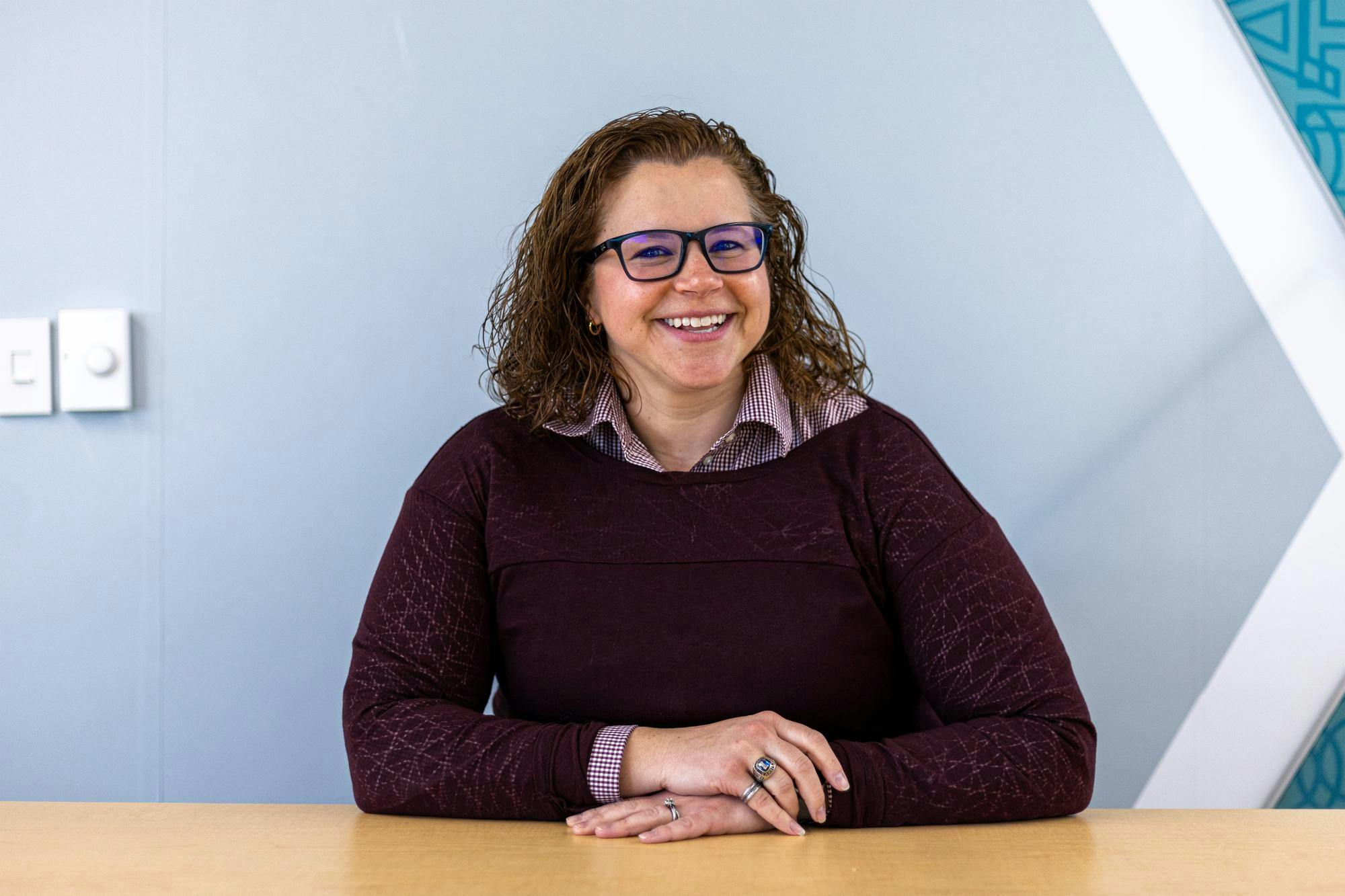 Leadership and Service Center Director Courtney Smith poses for a photo in a conference room at the Russell House on Jan. 13, 2026. Smith was previously involved with student engagement at Arizona State University.