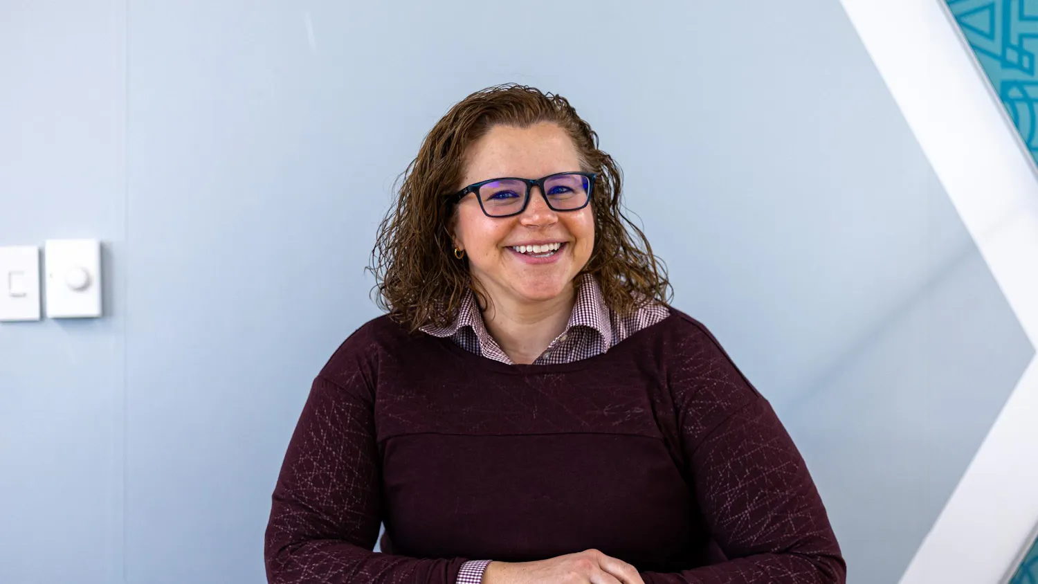 Leadership and Service Center Director Courtney Smith poses for a photo in a conference room at the Russell House on Jan. 13, 2026. Smith was previously involved with student engagement at Arizona State University.