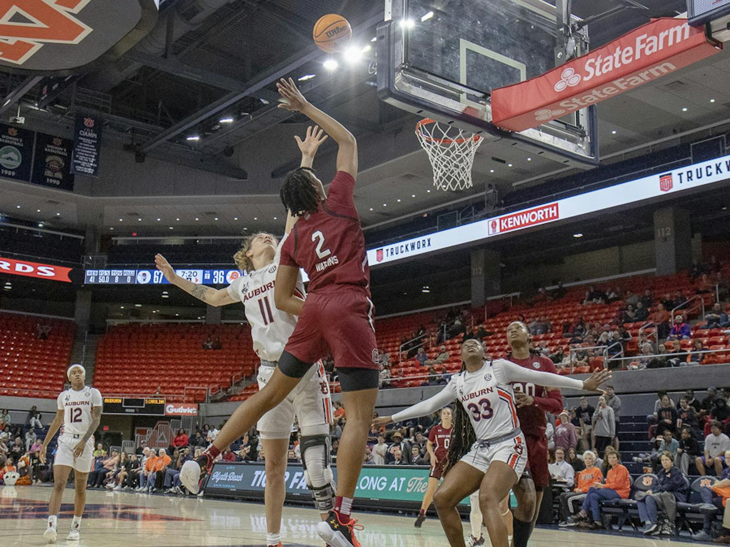 Freshman forward Ashlyn Watkins fends off a defender as she attempts to dunk the ball during the matchup against Auburn on Feb. 9, 2023. Watkins finished the game with a strong fourth quarter, grabbing five rebounds and one block in nine minutes.