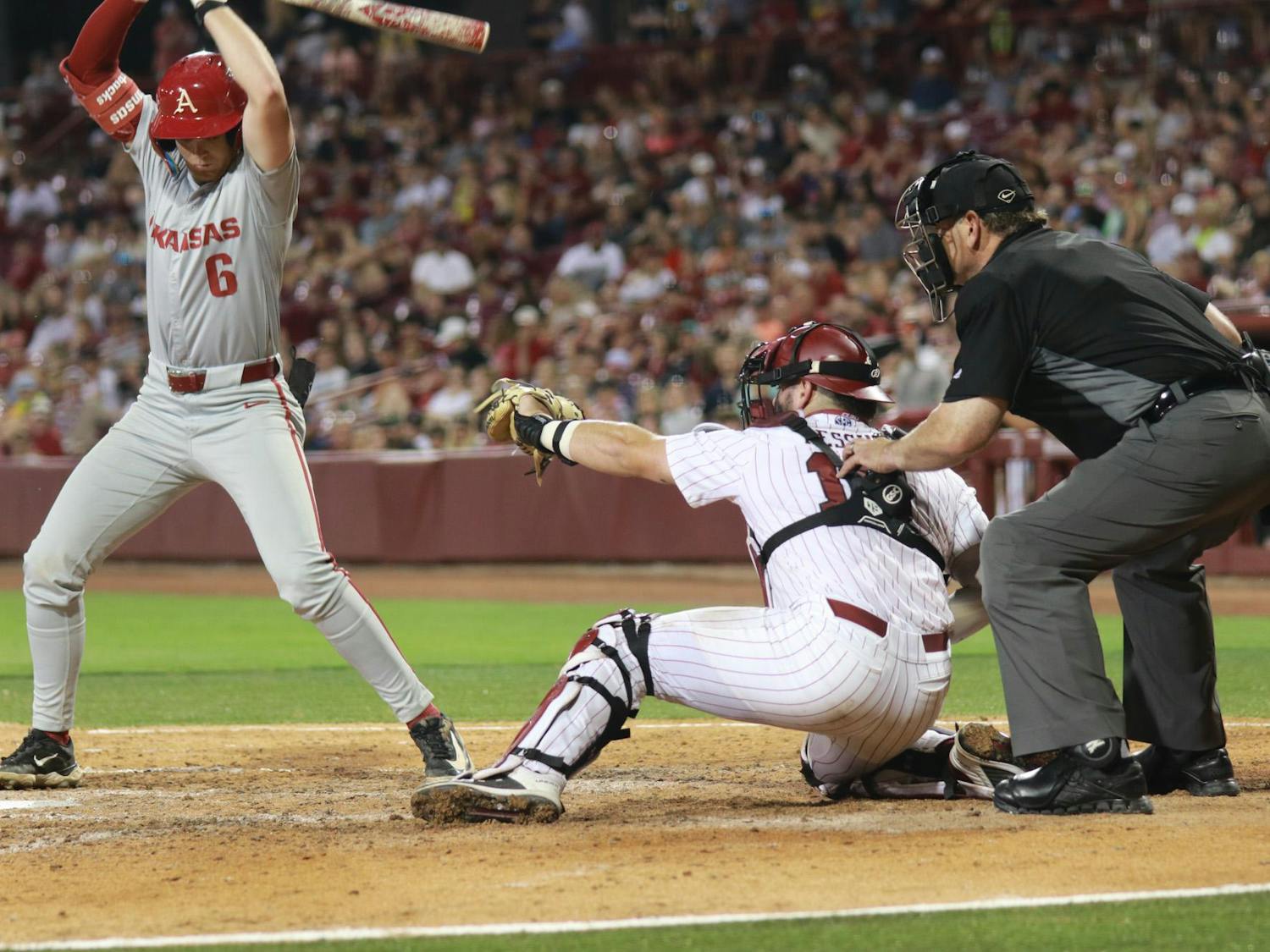 Junior catcher Cole Messina frames a strike at home plate against the Razorbacks on April 19, 2024, at Founders Park. Messina secured his 100th career RBI during the series and was recently named to the 2024 Buster Posey Award Mid-Season Watchlist, which honors the National Collegiate Catcher of the Year.