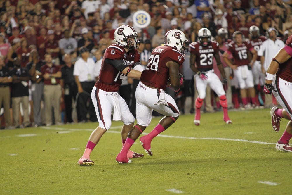 	Connor Shaw (14) and Mike Davis (28) have lead the Gamecocks to No. 30 in total offense.