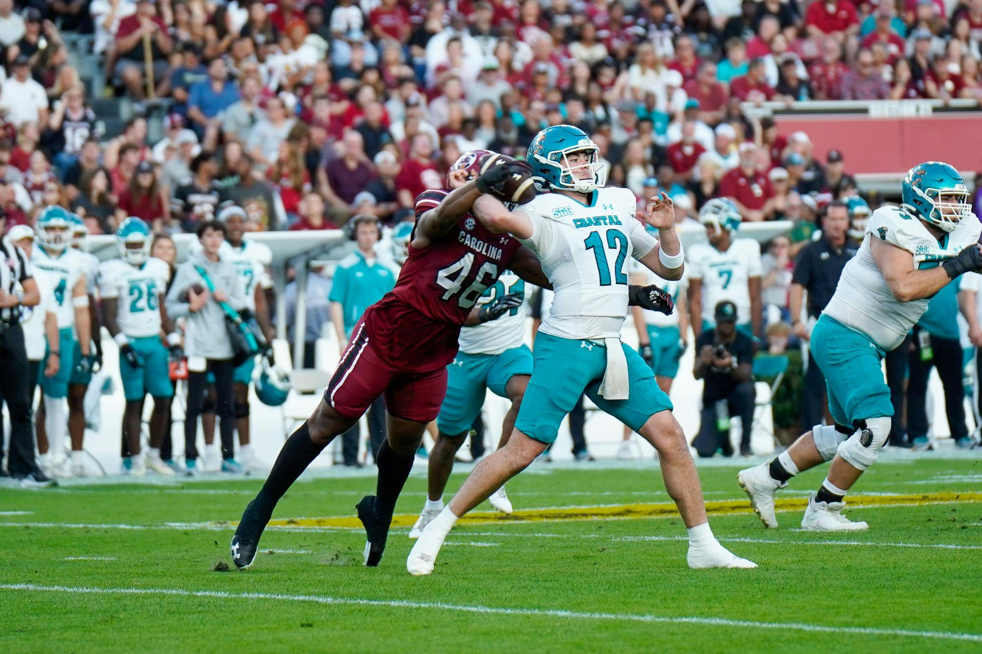 Senior edge rusher Bryan Thomas Jr. disrupts a pass from Coastal Carolina's quarterback at Williams-Brice Stadium on Nov. 22, 2025. Thomas finished the game with two solo tackles and one sack.